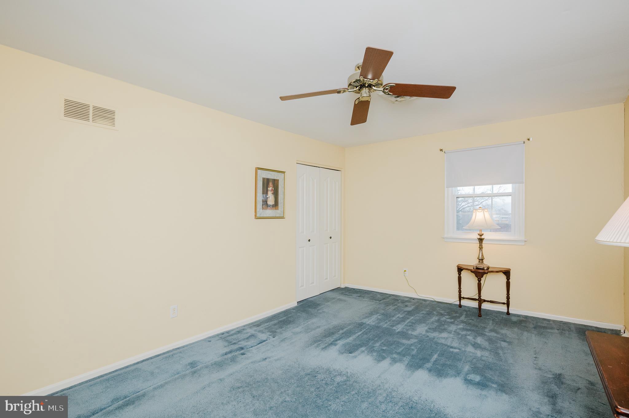 1303 Mill Creek Road Fallston, MD 21047 - Photo 36 of 58 a view of a livingroom with a hardwood floor and a ceiling fan