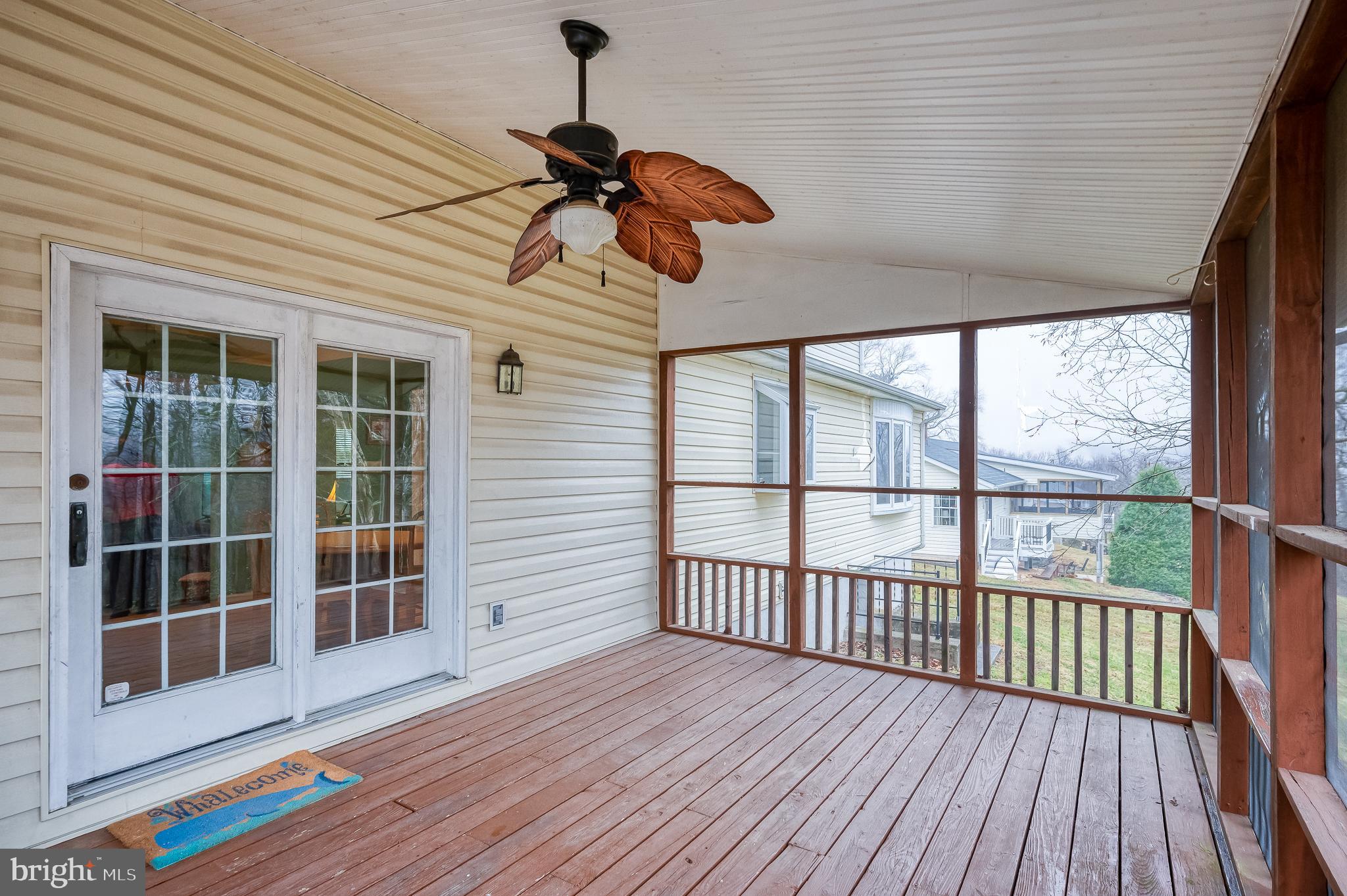 1303 Mill Creek Road Fallston, MD 21047 - Photo 51 of 58 a view of a balcony with wooden floor and iron stairs