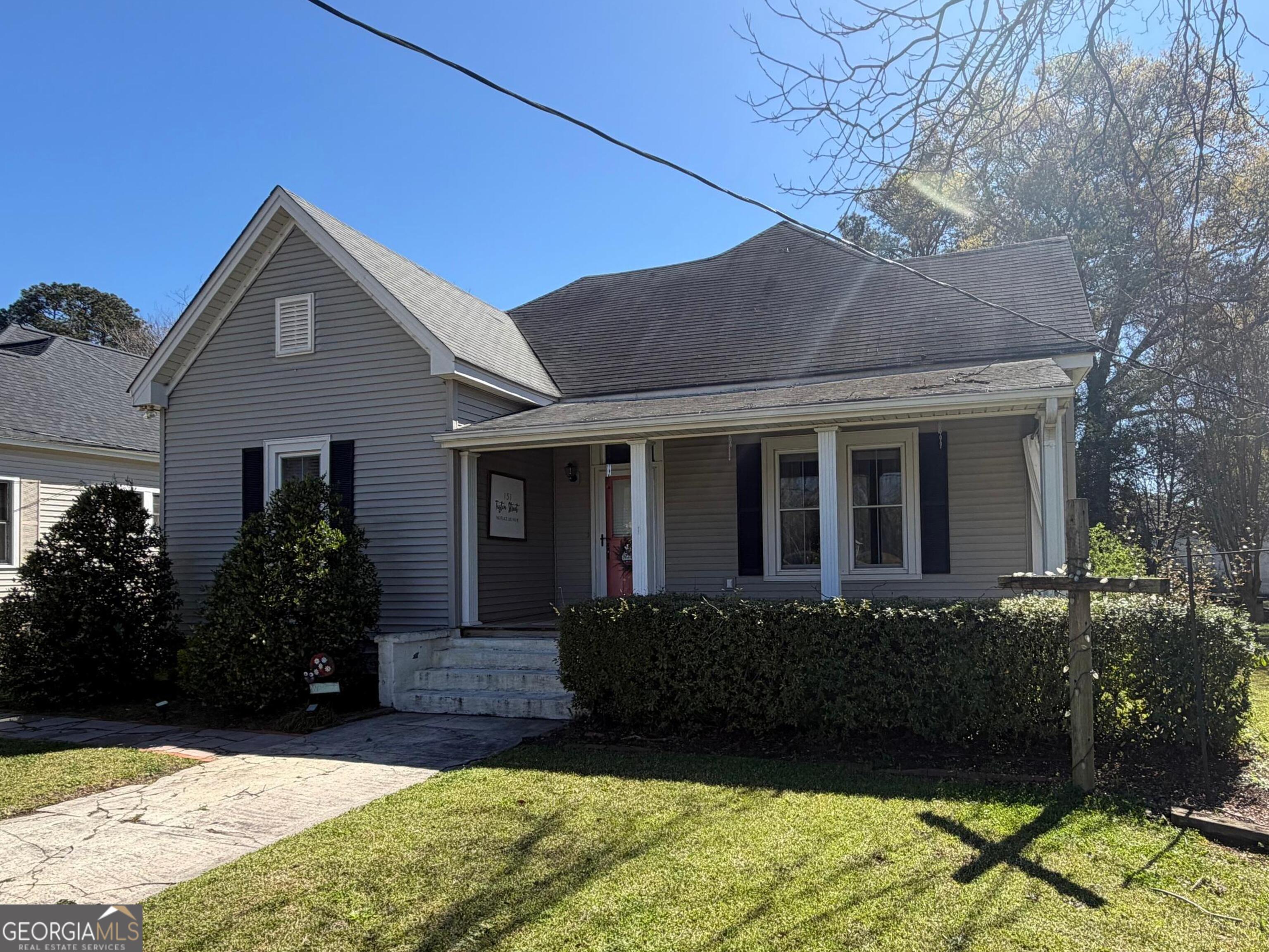 a house view with a garden space