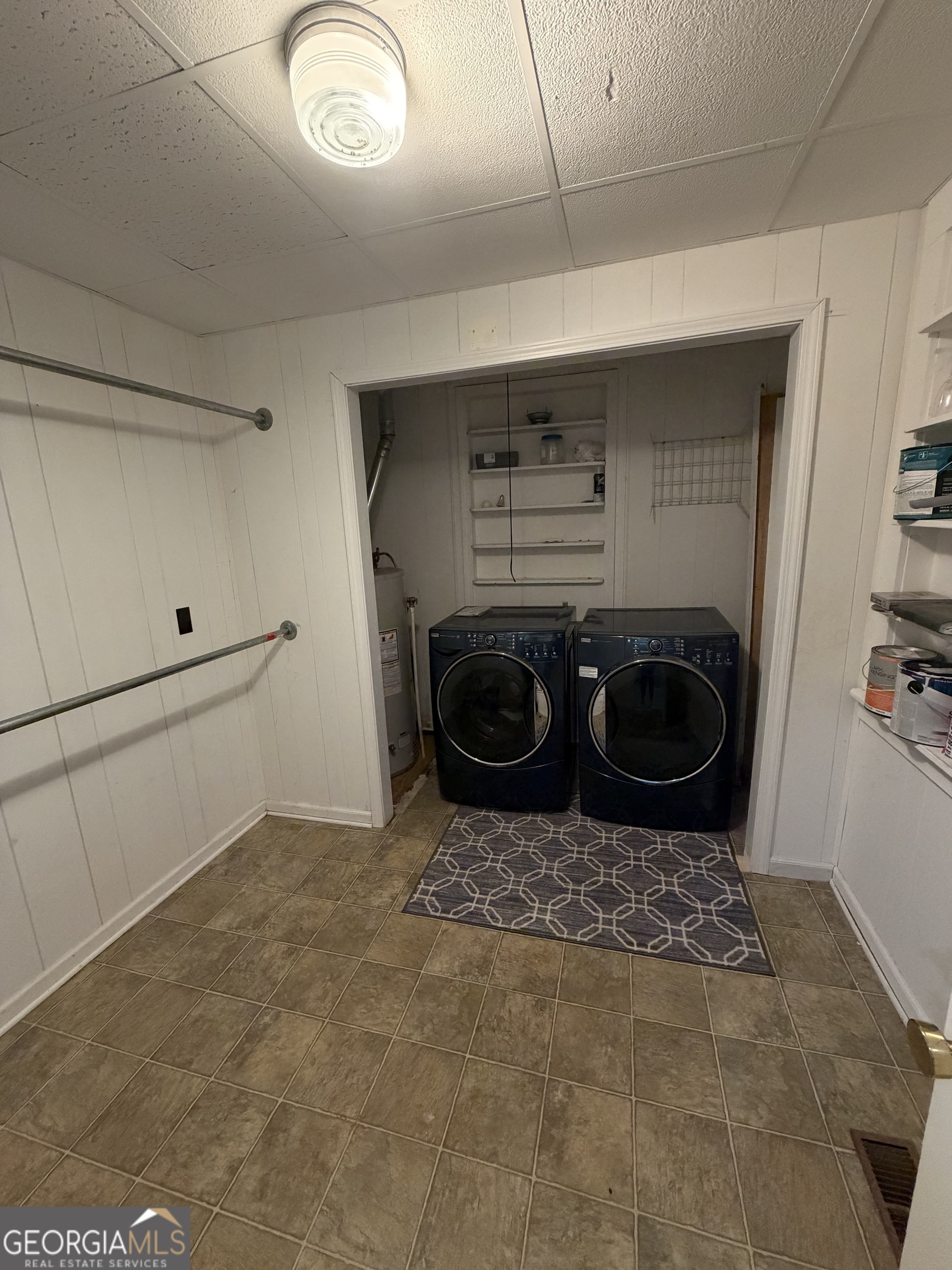 151 Tusten Street Elberton, GA 30635 - Photo 13 of 30 a bathroom with a washing machine and a sink