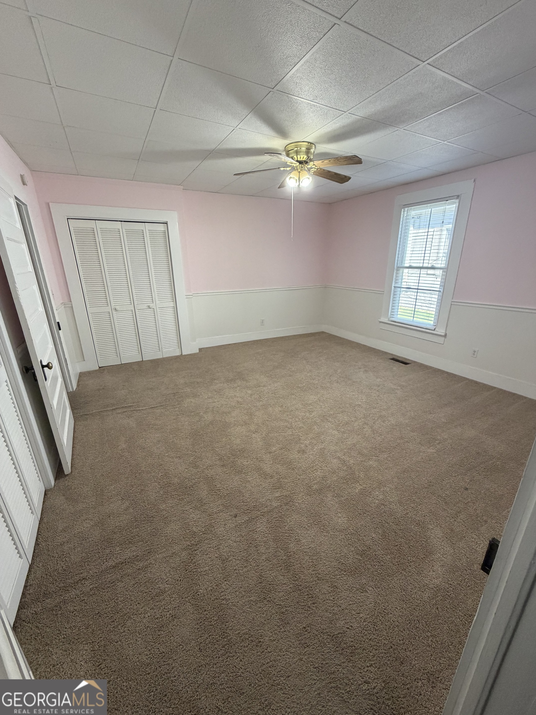 151 Tusten Street Elberton, GA 30635 - Photo 16 of 30 a view of a livingroom with a ceiling fan and window