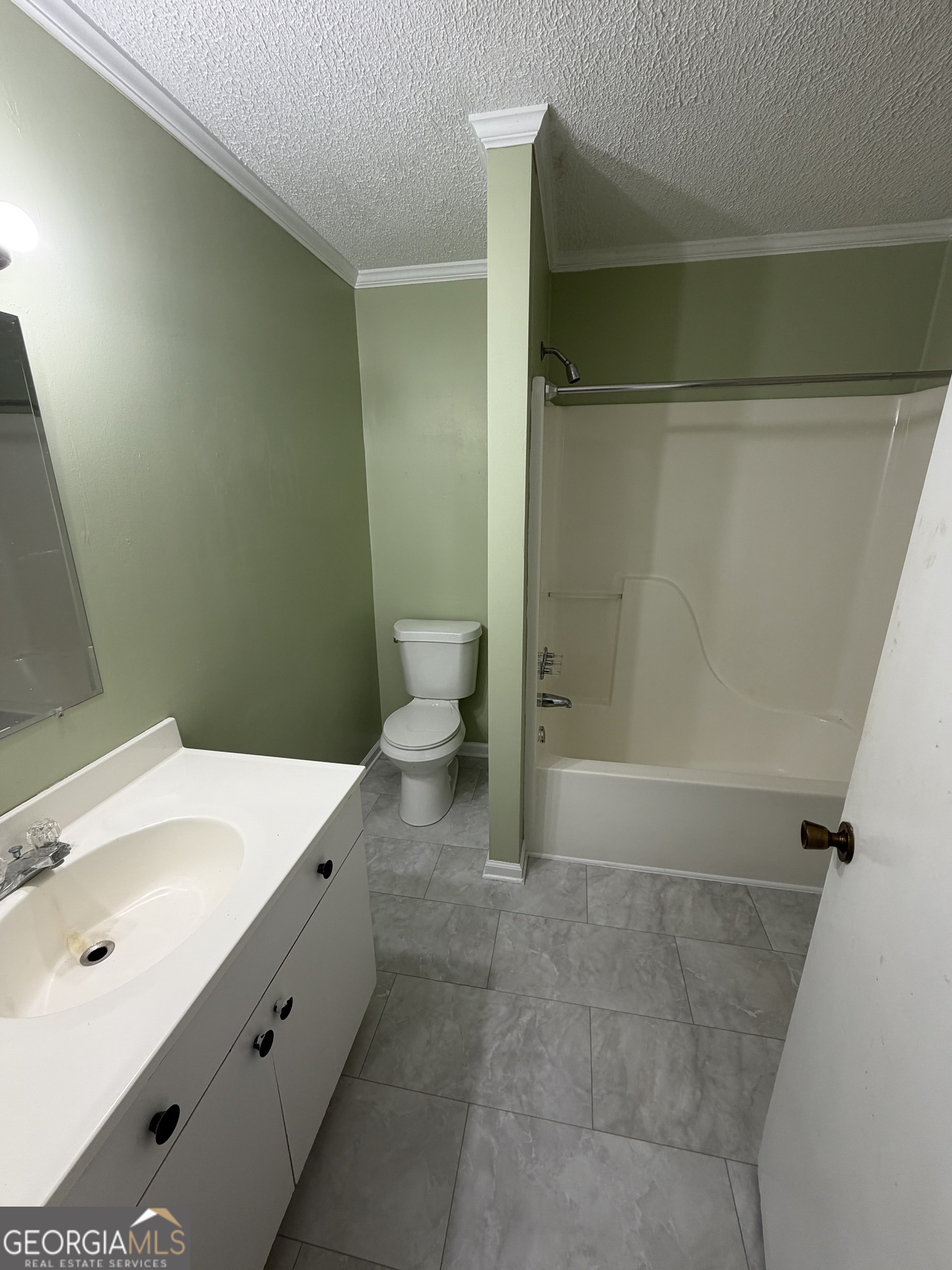 151 Tusten Street Elberton, GA 30635 - Photo 23 of 30 a bathroom with a sink a toilet and shower