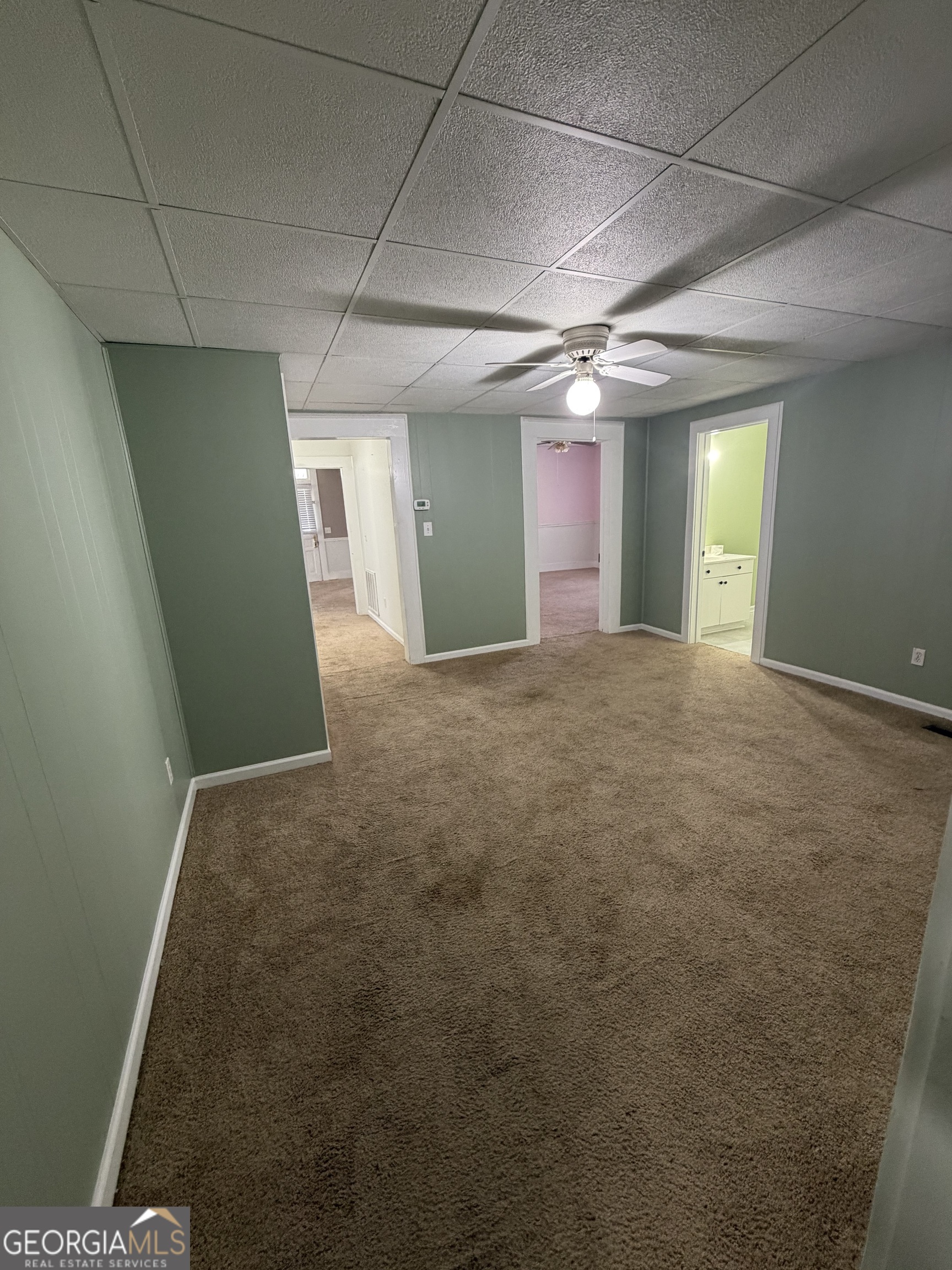 151 Tusten Street Elberton, GA 30635 - Photo 24 of 30 a view of a big room with windows and fireplace