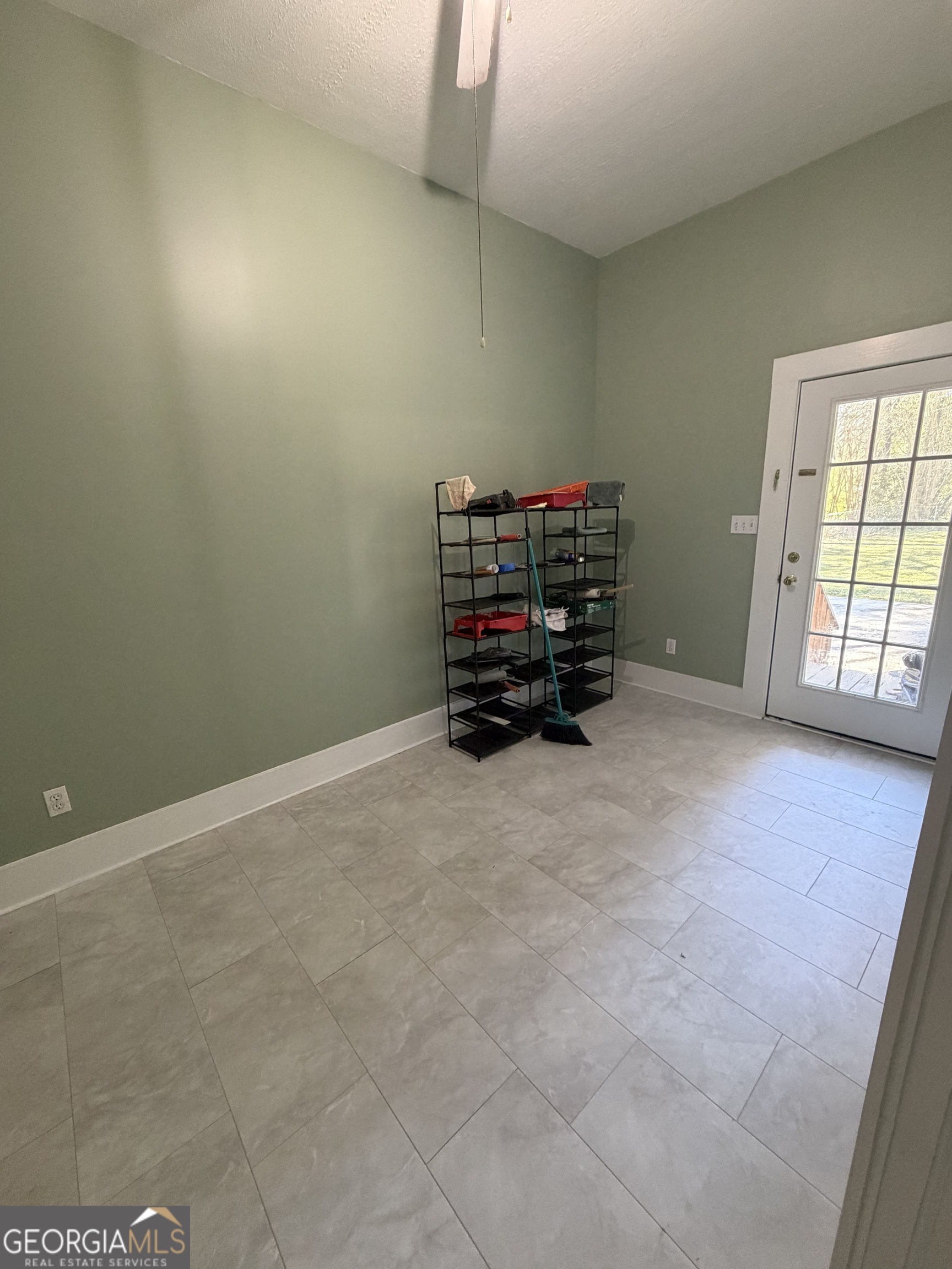 151 Tusten Street Elberton, GA 30635 - Photo 26 of 30 an empty room with furniture and a window