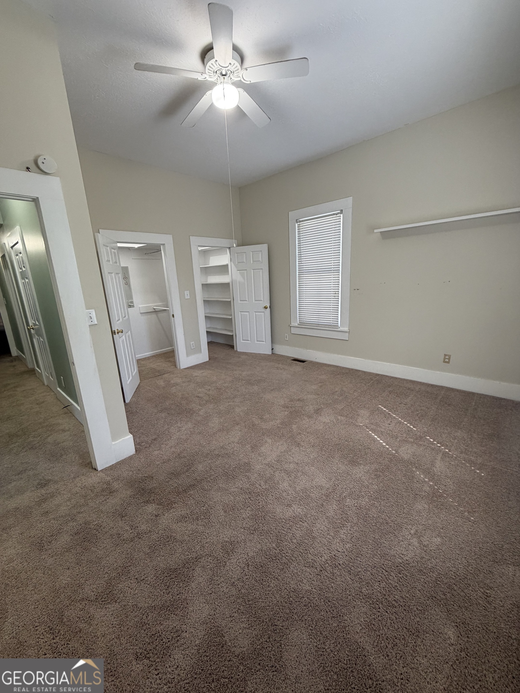 151 Tusten Street Elberton, GA 30635 - Photo 27 of 30 a view of a livingroom with an empty space and a ceiling fan
