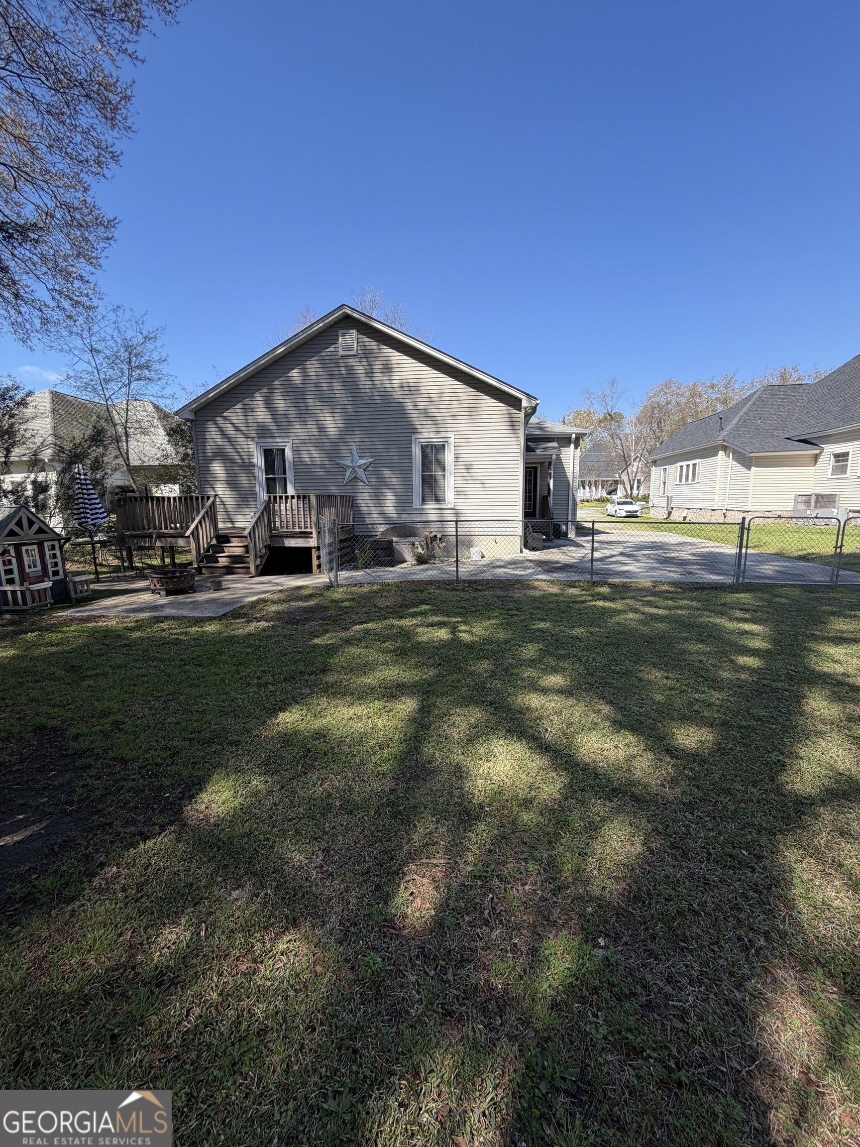 151 Tusten Street Elberton, GA 30635 - Photo 5 of 30 a backyard of a house with lots of green space and outdoor seating