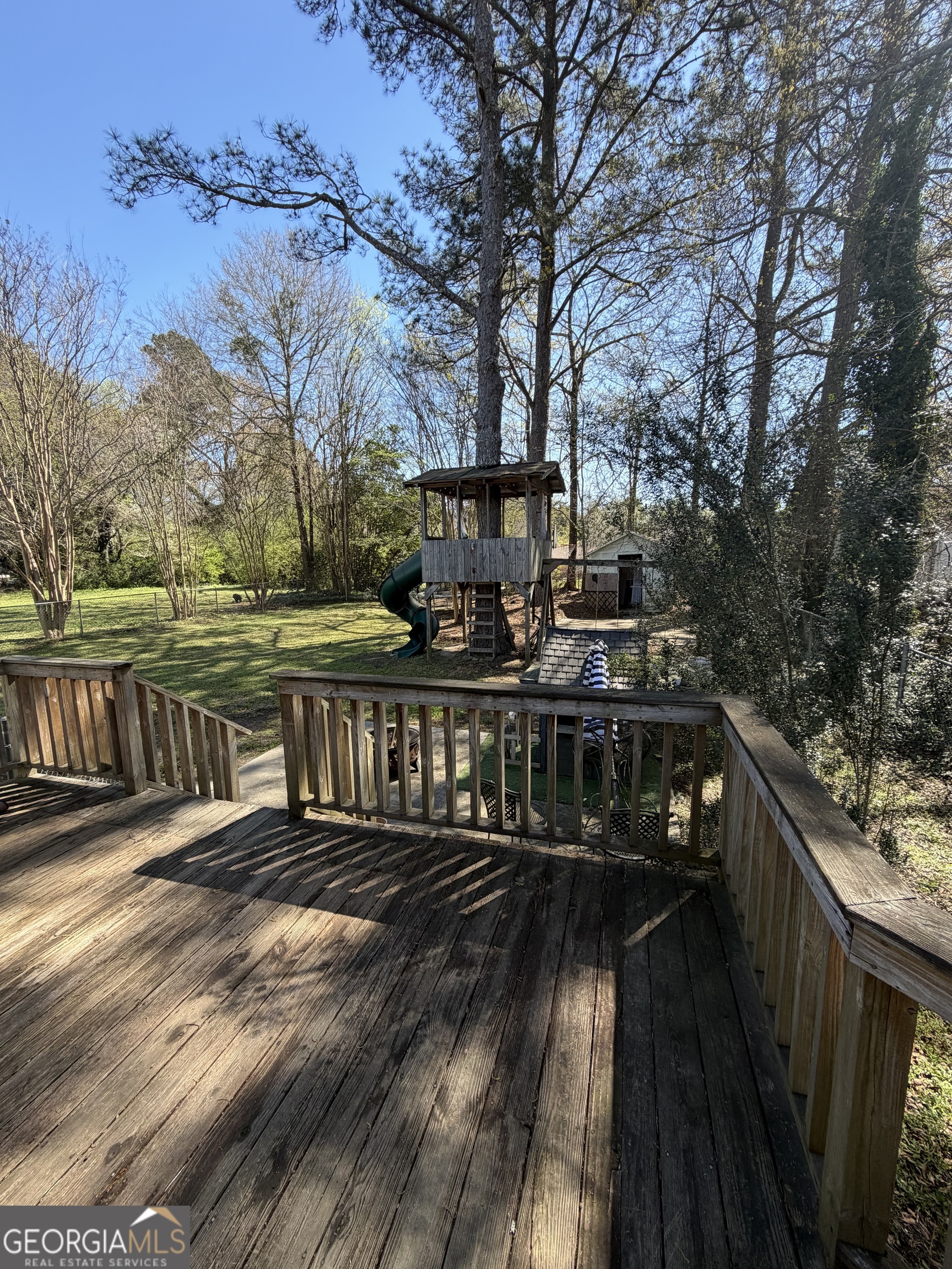 151 Tusten Street Elberton, GA 30635 - Photo 6 of 30 a view of balcony with wooden floor and outdoor seating