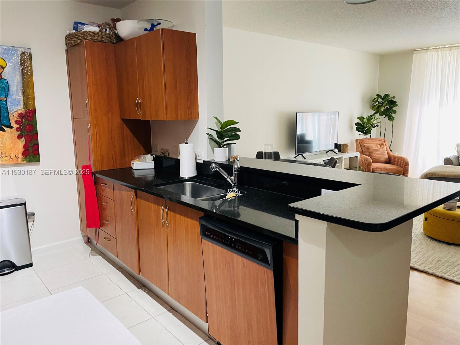 2775 Northeast 187th Street, Unit 628 Aventura, FL 33180 - Photo 13 of 19 a kitchen with sink and cabinets