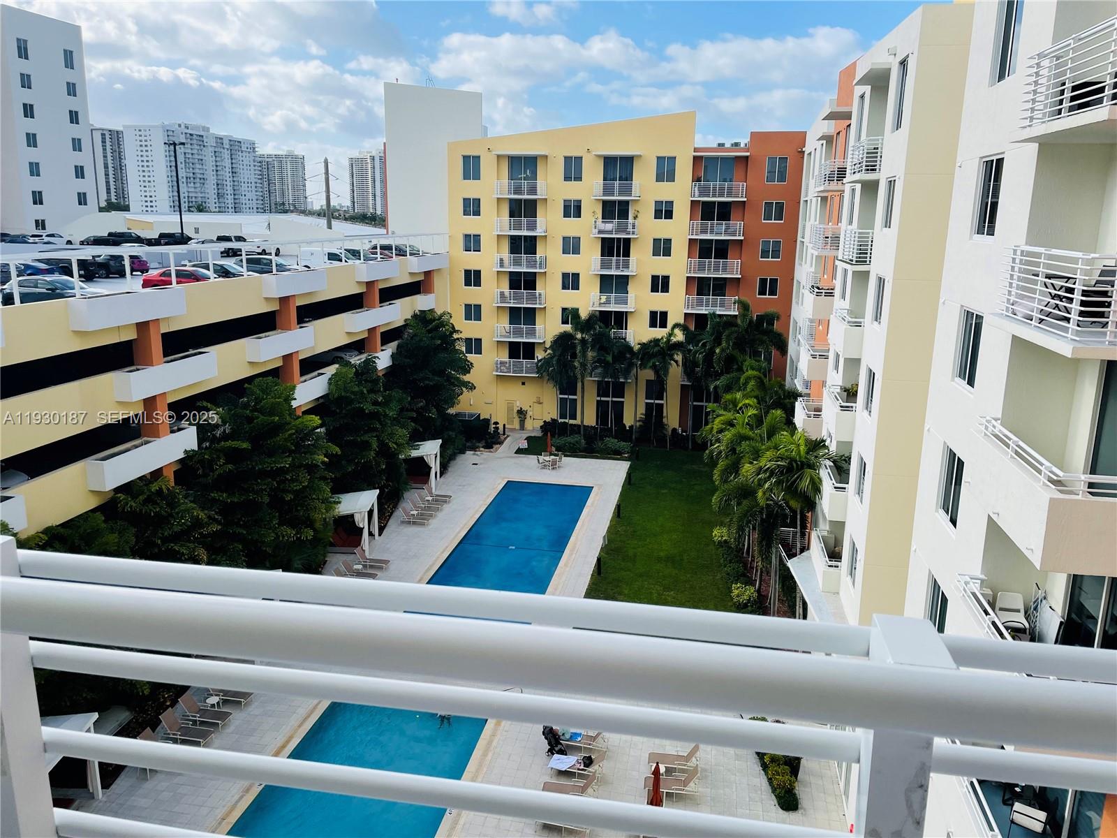 2775 Northeast 187th Street, Unit 628 Aventura, FL 33180 - Photo 19 of 19 a view of pool with outdoor seating