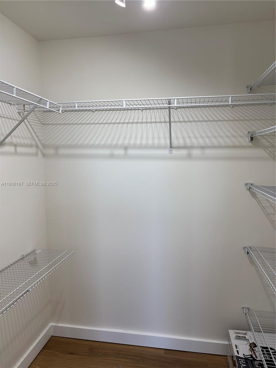 2775 Northeast 187th Street, Unit 628 Aventura, FL 33180 - Photo 10 of 19 a view of a room with racks on the wall