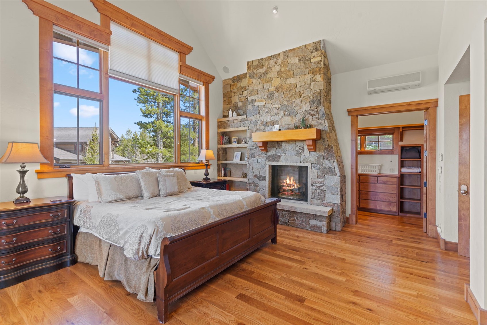 317 Timbertrail Road Breckenridge, CO 80424 - Photo 27 of 50 a bedroom with a bed and a fireplace
