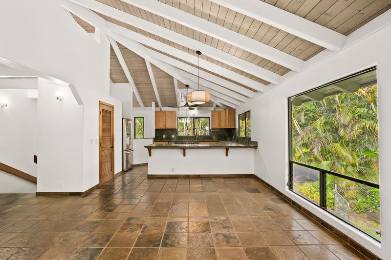 4485 Pilikoa Street Hanalei, HI 96714 - Photo 14 of 30 a view of empty room with wooden floor and windows