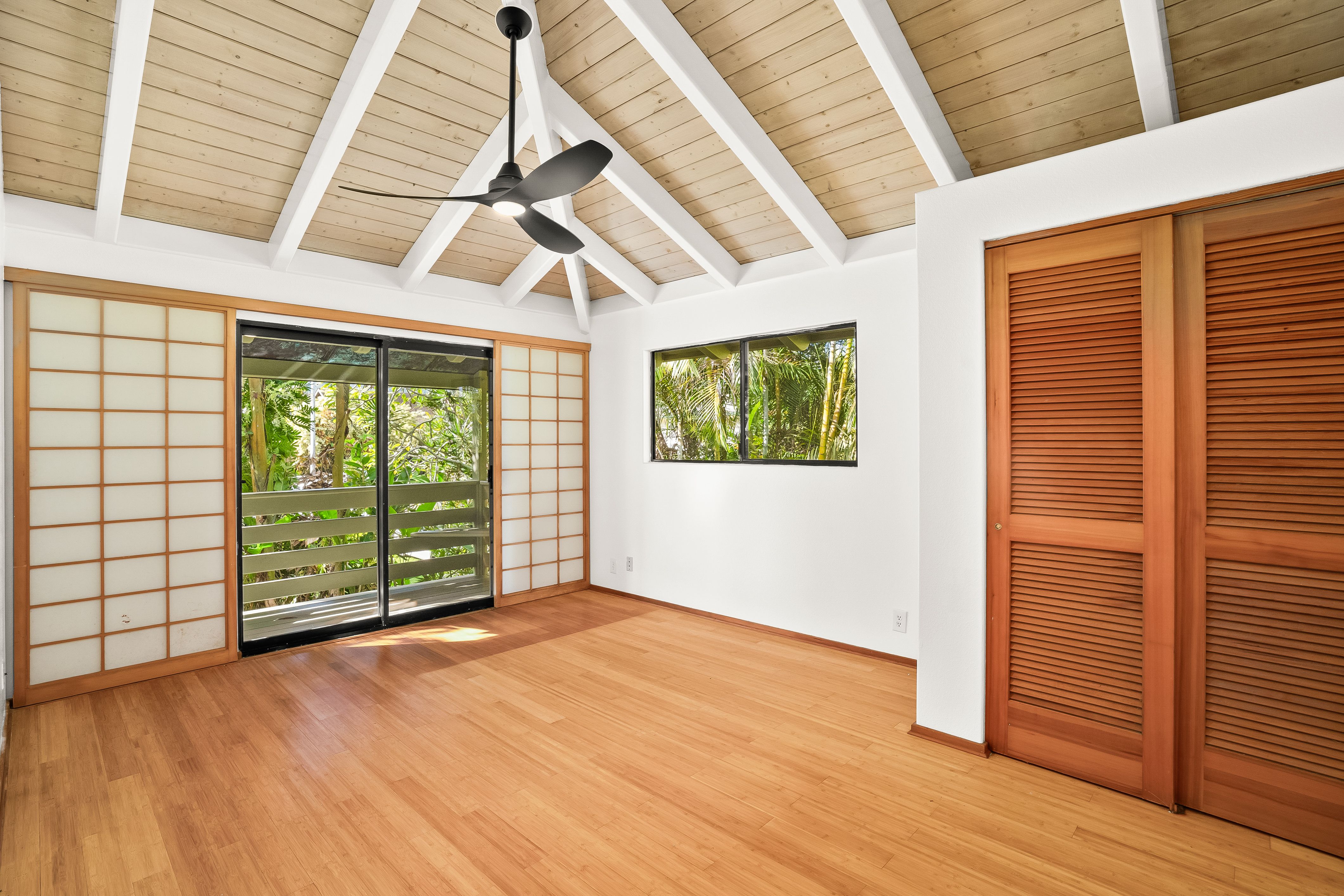 4485 Pilikoa Street Hanalei, HI 96714 - Photo 21 of 30 an empty room with wooden floor and windows