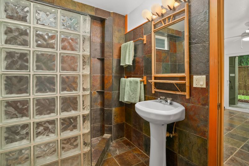 4485 Pilikoa Street Hanalei, HI 96714 - Photo 27 of 30 a bathroom with a sink a toilet and shower