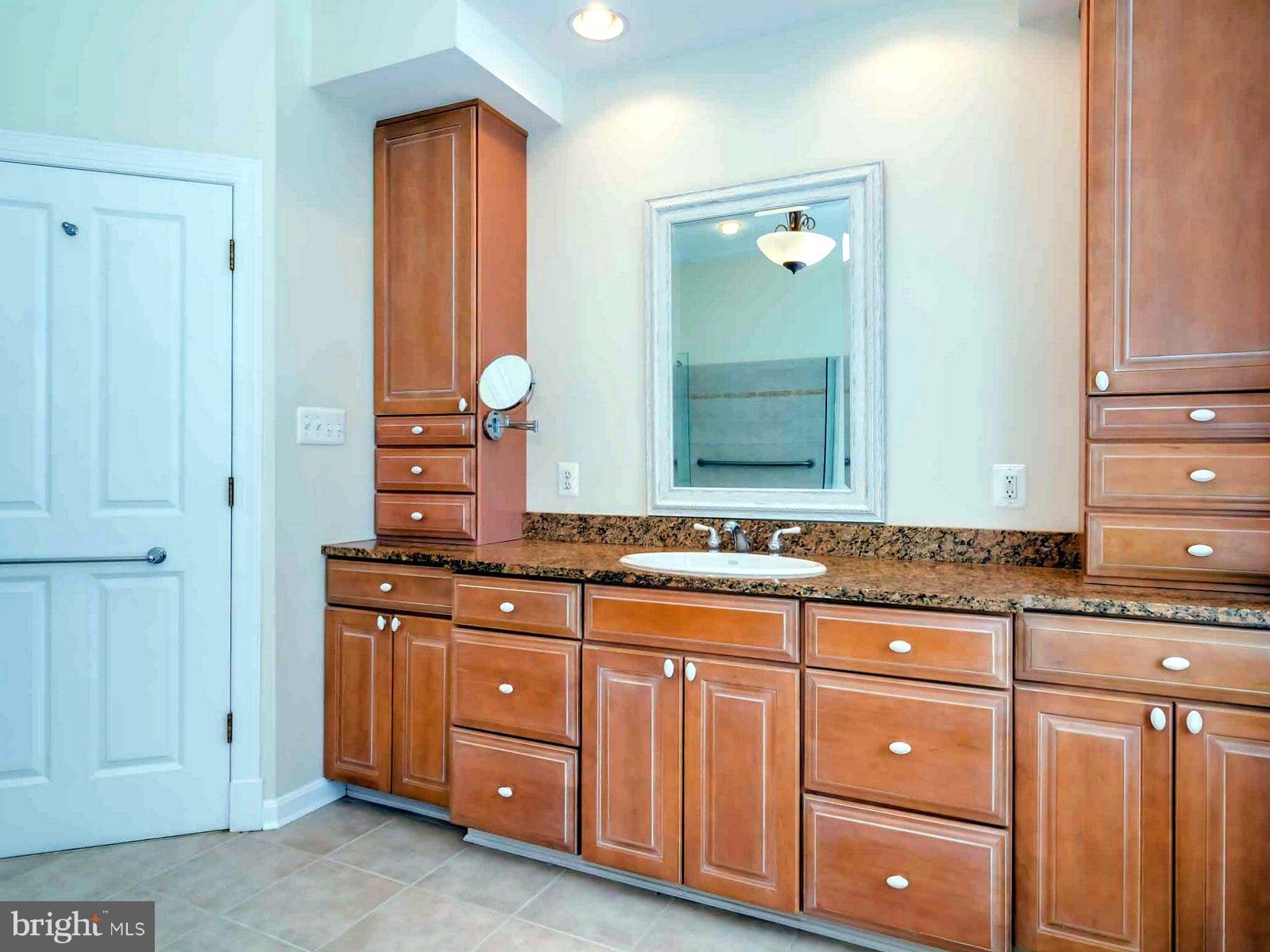 5825 Bayside Road St. Leonard, MD 20685 - Photo 16 of 30 has Solid Wood Cabinet,Granite & Ceramic