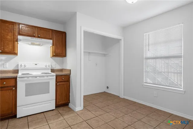 a view of storage and utility room with washer and dryer