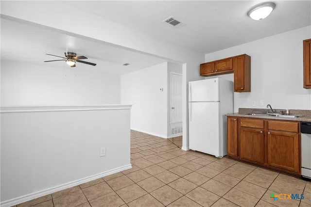 a view of a kitchen with a sink