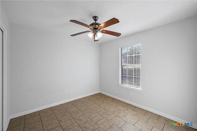 a view of empty room with windows