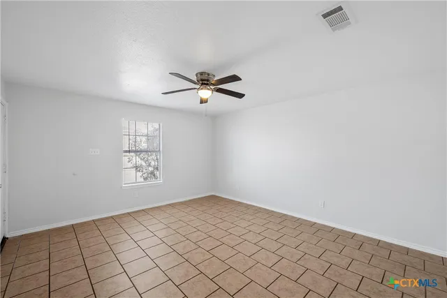a view of an empty room and window