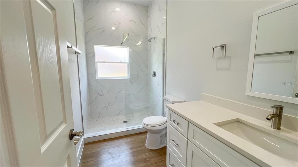 6741 Heavitree Drive Sebring, FL 33876 - Photo 11 of 29 a bathroom with a sink a toilet and shower