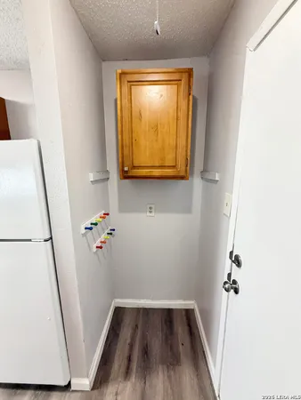 a view of front door with wooden floor