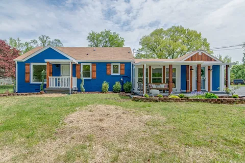 front view of a house with a yard