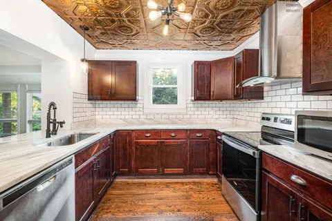 a kitchen with a sink and cabinets
