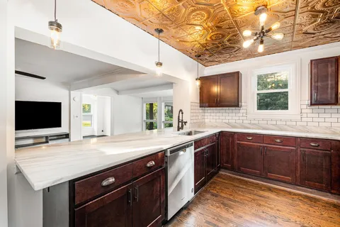 a spacious bathroom with a sink and a large mirror
