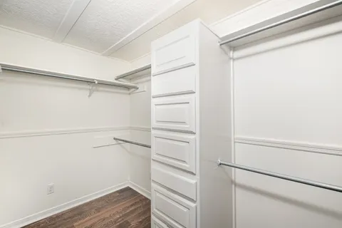 a view of an empty walk in closet