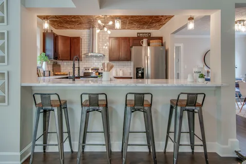 a view of kitchen and dining area with a sink