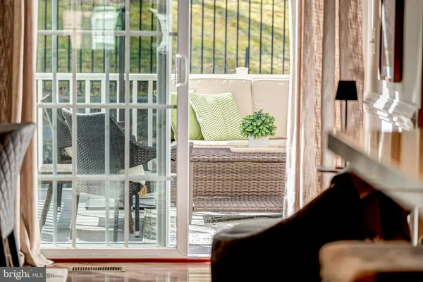 a view of a balcony with furniture