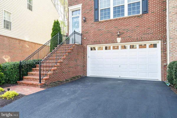 a front view of a house with a garage