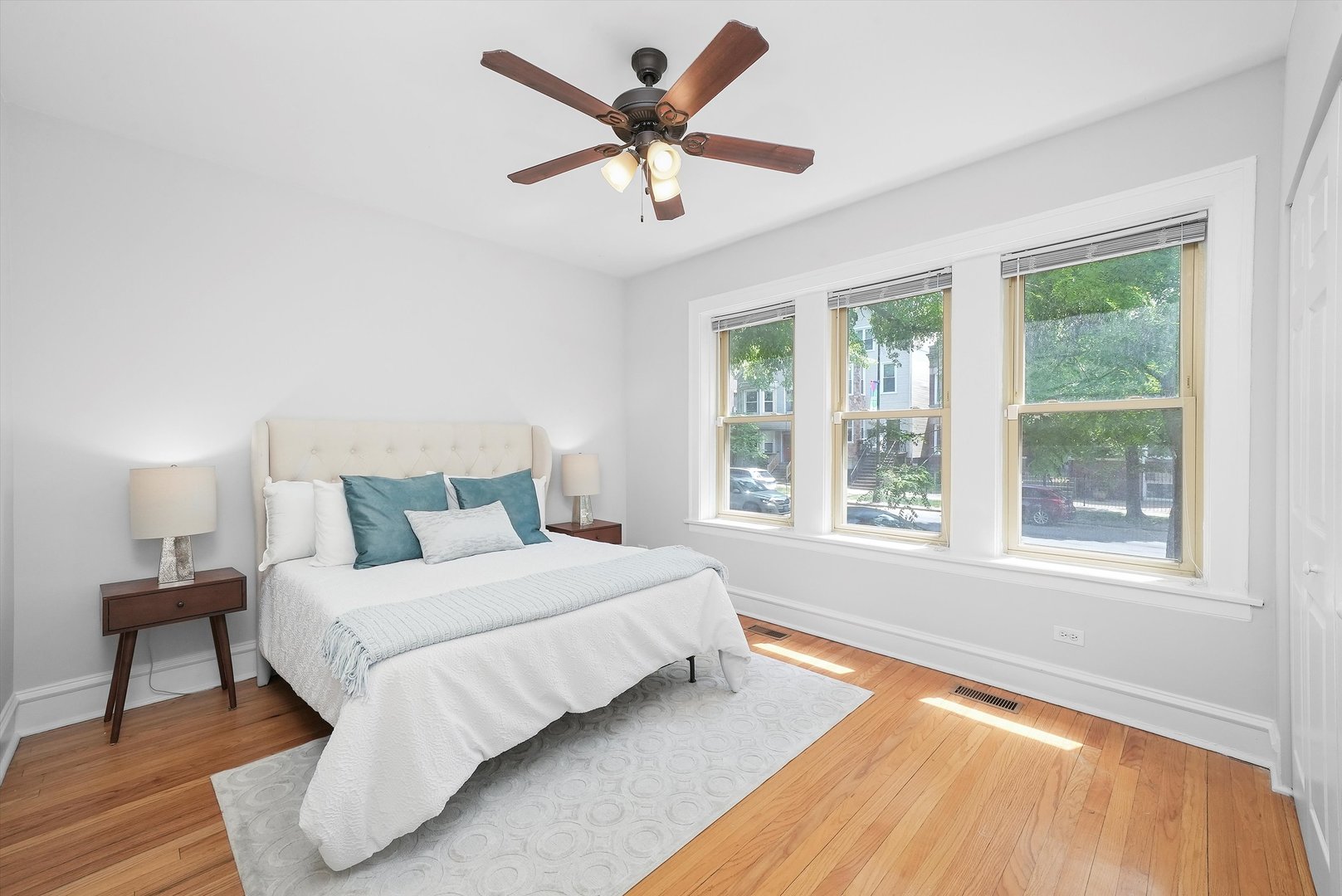 1928 West Addison Street, Unit 1S Chicago, IL 60613 - Photo 11 of 25 a bedroom with a bed and a large window