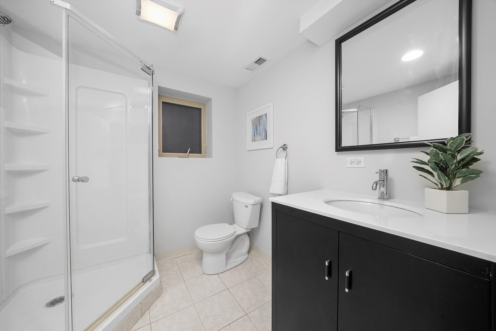 1928 West Addison Street, Unit 1S Chicago, IL 60613 - Photo 18 of 25 a bathroom with a sink a toilet and a mirror