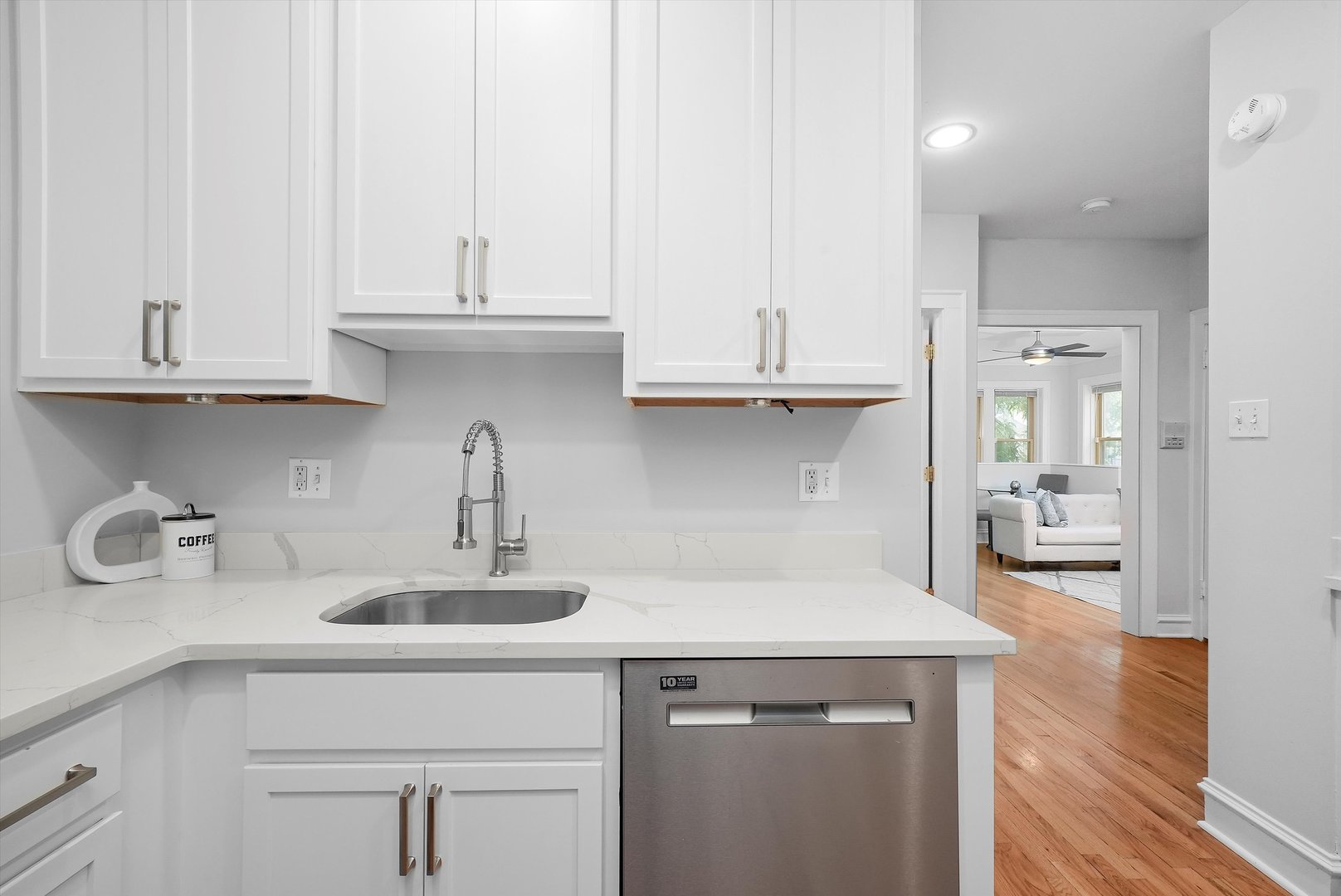 1928 West Addison Street, Unit 1S Chicago, IL 60613 - Photo 5 of 25 a kitchen with stainless steel appliances granite countertop a sink and cabinets