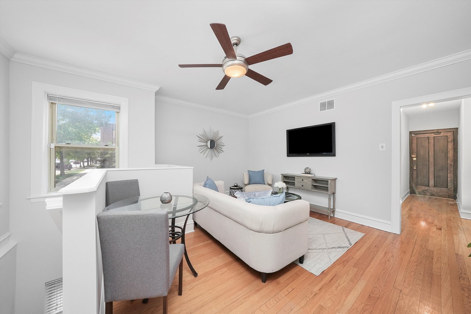 1928 West Addison Street, Unit 1S Chicago, IL 60613 - Photo 10 of 25 a living room with furniture and a flat screen tv