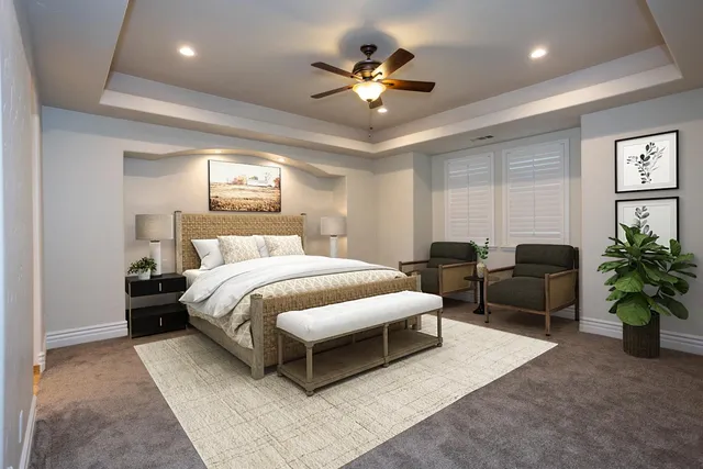 a spacious bedroom with a bed a chandelier and a couch