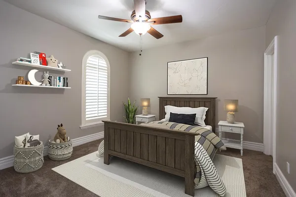 a bedroom with a bed and a chandelier