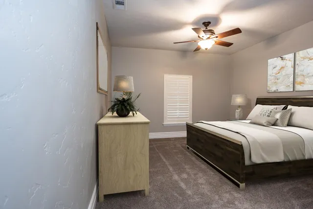 a bed room with a bed and a chandelier