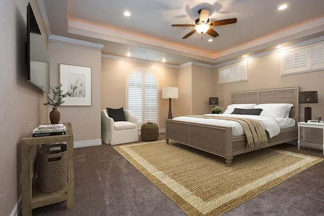 a bedroom with a bed and a chandelier