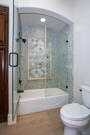 a bathroom with a bathtub and a shower