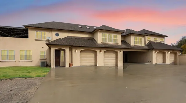 a front view of a house with yard