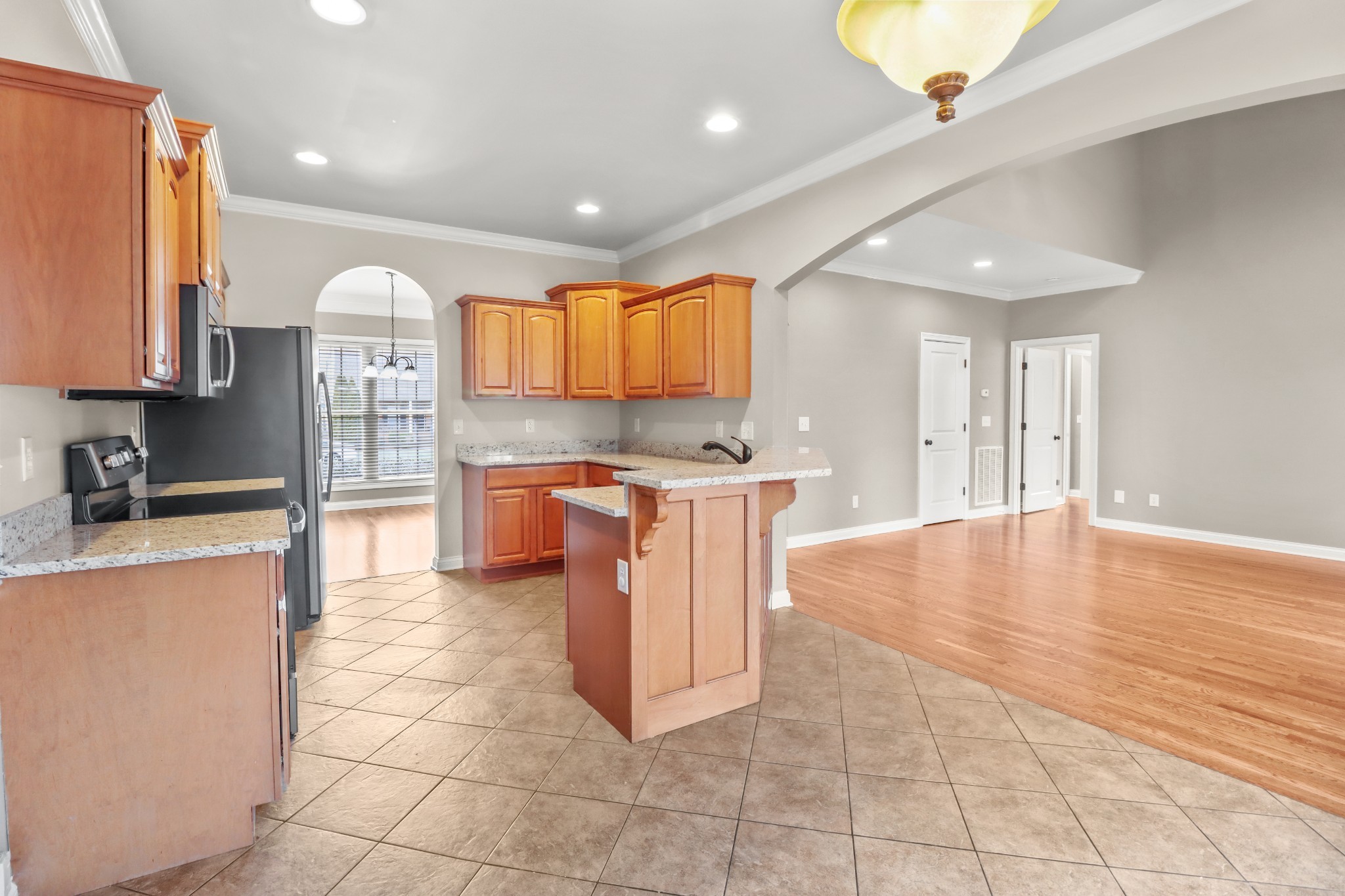 331 Tivoli Trail Springfield, TN 37172 - Photo 18 of 44 a kitchen with stainless steel appliances granite countertop a stove a sink and a refrigerator