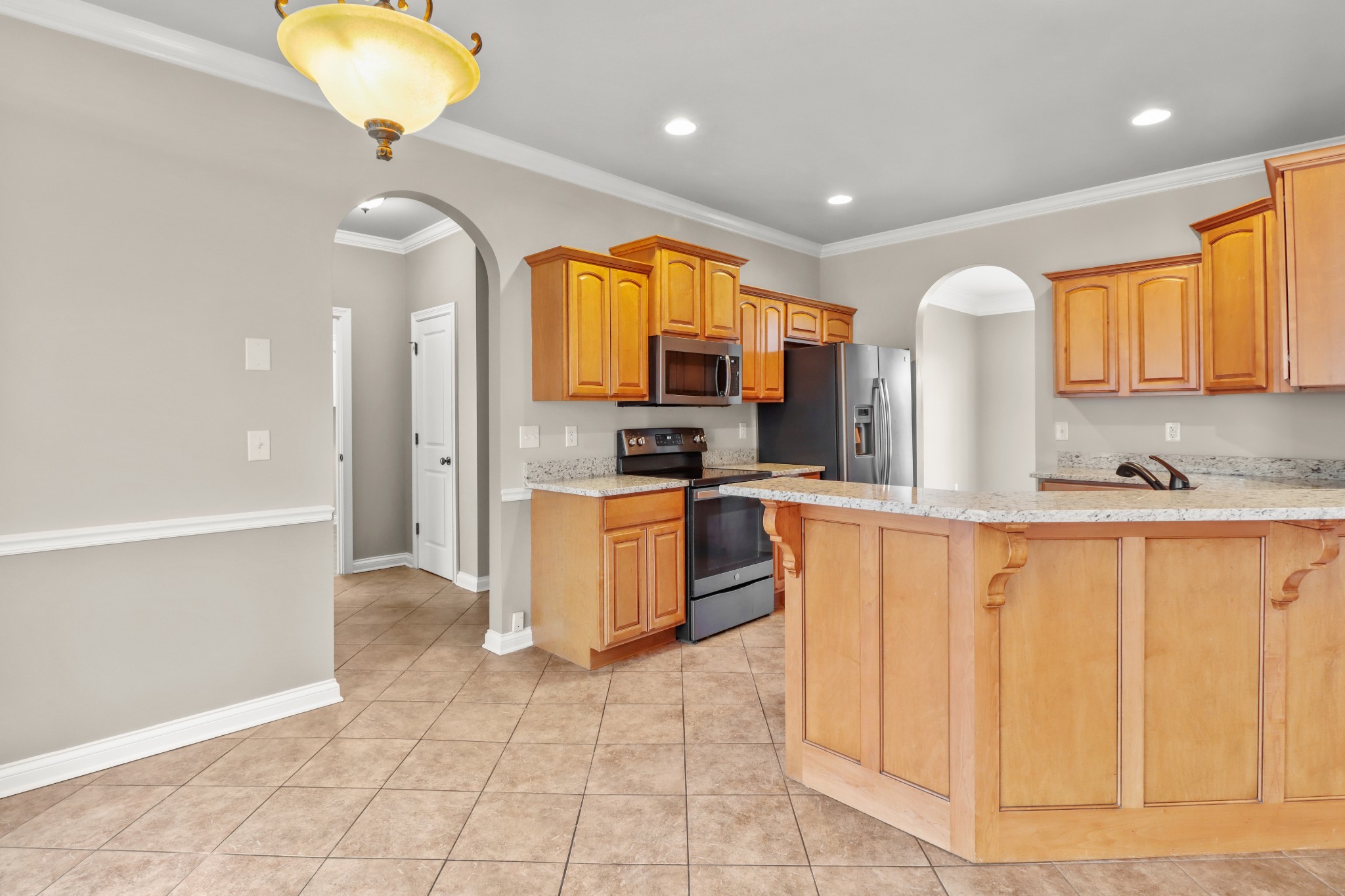 331 Tivoli Trail Springfield, TN 37172 - Photo 20 of 44 a kitchen with stainless steel appliances granite countertop a stove a sink and a refrigerator