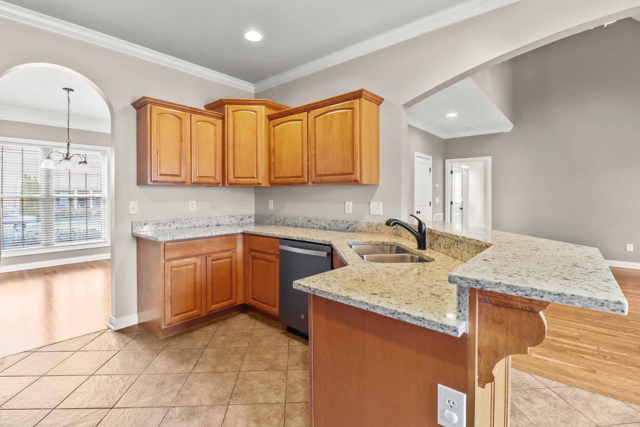 331 Tivoli Trail Springfield, TN 37172 - Photo 22 of 44 a kitchen with granite countertop a sink and a stove