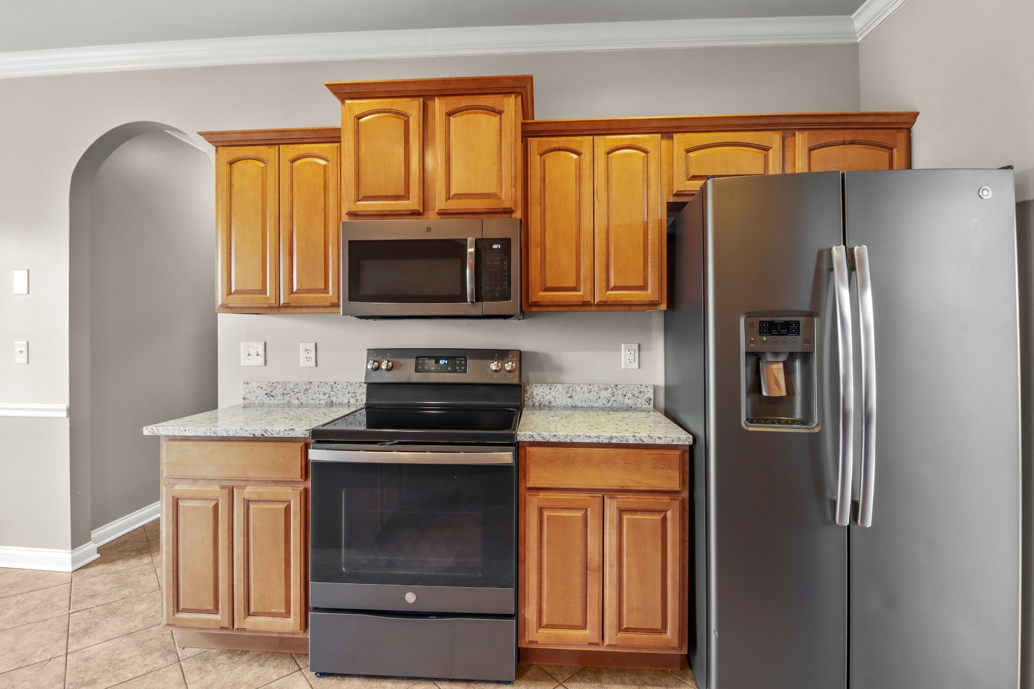 331 Tivoli Trail Springfield, TN 37172 - Photo 23 of 44 a kitchen with granite countertop a refrigerator stove and microwave