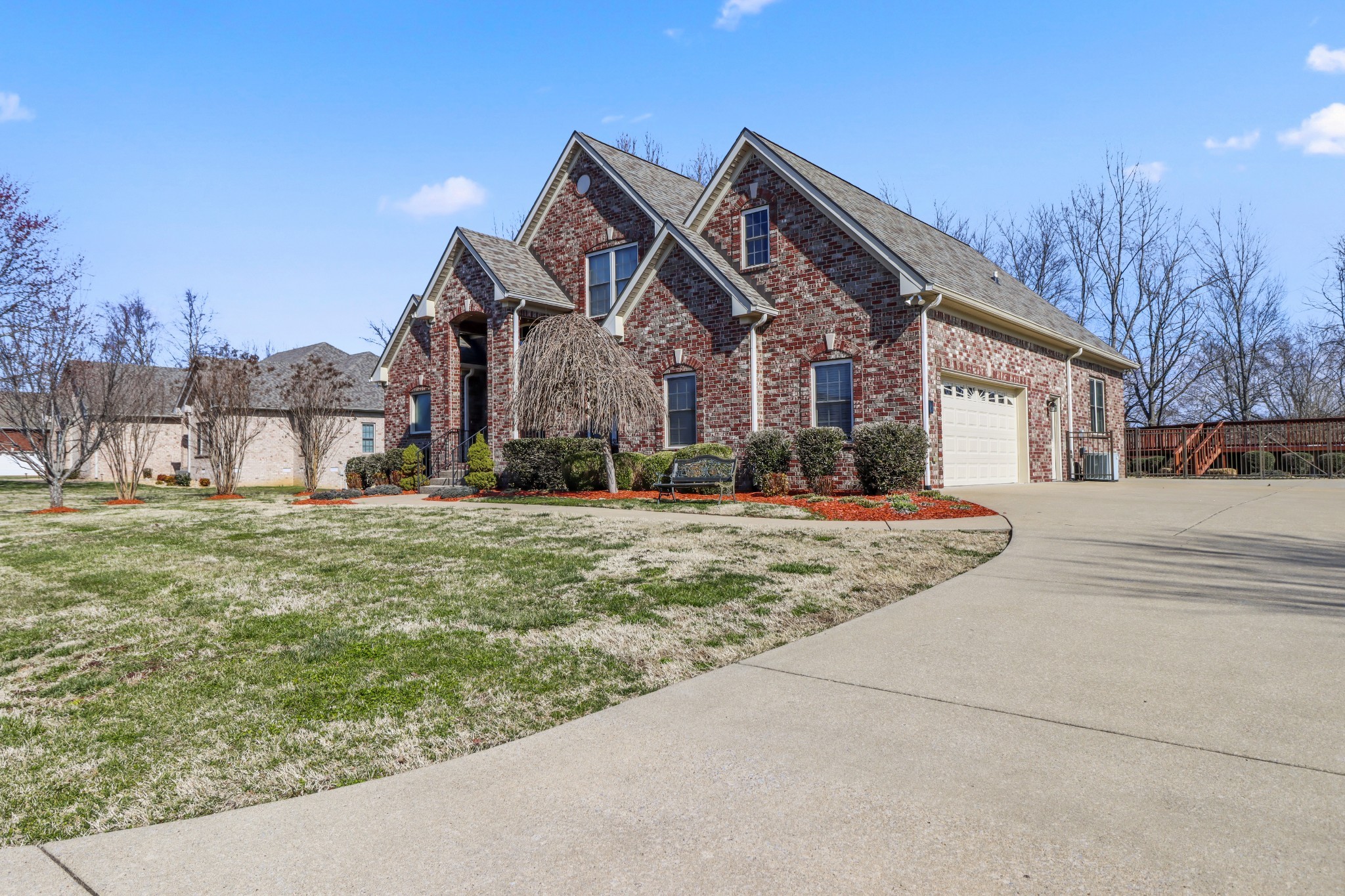 331 Tivoli Trail Springfield, TN 37172 - Photo 3 of 44 a view of a big house with a large tree and plants