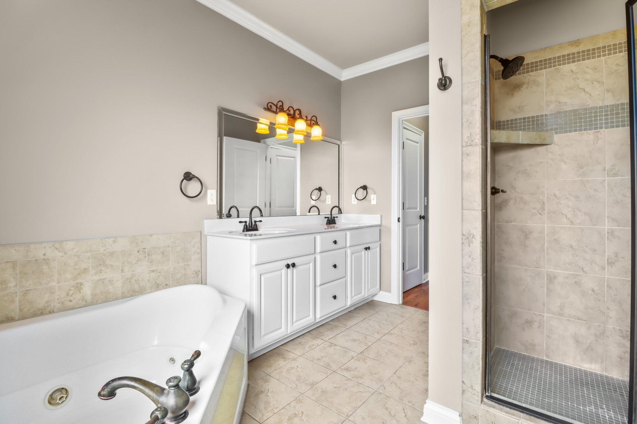 331 Tivoli Trail Springfield, TN 37172 - Photo 35 of 44 a bathroom with a tub sink and mirror