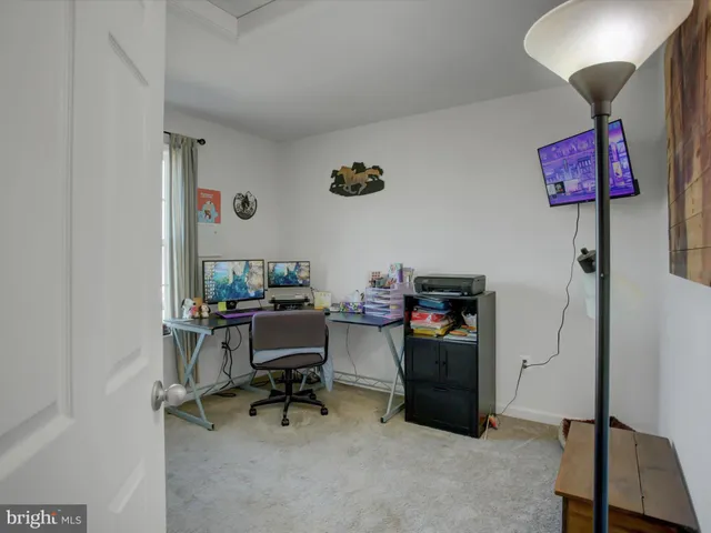 a view of a workspace with furniture