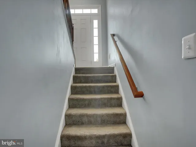 a view of a roof deck with furniture
